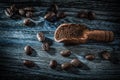 Ground coffee grains scoop on vintage wood board Royalty Free Stock Photo