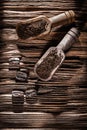 Ground coffee grains in scoop on vintage wooden board Royalty Free Stock Photo