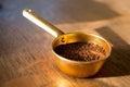 Ground coffee in measuring cup Royalty Free Stock Photo