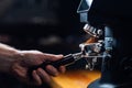 Ground coffee pouring into a portafilter with a grinder Royalty Free Stock Photo