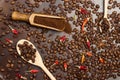 Ground coffee in wooden scoop. Roasted coffee beans in spoon. Roasted coffee beans on table Royalty Free Stock Photo