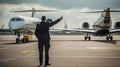 ground crew marshal signaling a private jet while taking off from the airport