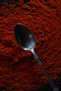 Ground dry red pepper spice, full frame, with old metal teaspoon Royalty Free Stock Photo