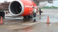 Ground handling staff checked the airplane's engine before flight at Sultan Hasanuddin International Airpor