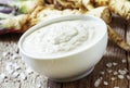 Ground horseradish, hot sauce to the food in a white bowl, roots Royalty Free Stock Photo