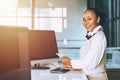 Ground hostess airport reception at airline check in counter staff worker the happy smiling Royalty Free Stock Photo