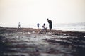 Ground level shot of people on the coast of a sea in Puerto Lempira, Honduras