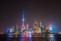 Ground level shot of Shanghai Pudong skyline by night. A long shutter with the beautiful neon lights of the city. Looking over the