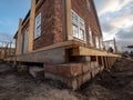 The Ground Level Shows the Foundation and Lower Brick Structure of the House Royalty Free Stock Photo