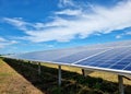 Ground Mounted Solar Power Plant on clouds in the blue sky. Royalty Free Stock Photo