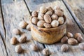 Ground nutmeg in  bowl and whole nuts on an old wooden background Royalty Free Stock Photo
