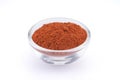 Ground paprika in glass bowl isolated on white background Royalty Free Stock Photo