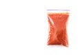 Ground paprika in a plastic bag isolated on white background Royalty Free Stock Photo