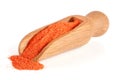 Ground paprika in a wooden scoop isolated on a white background Royalty Free Stock Photo