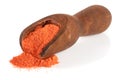 Ground paprika in a wooden scoop isolated on a white background Royalty Free Stock Photo