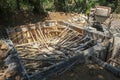 The ground recessed pool in the process of construction. Masonry formwork reinforced with bamboo trunks. Excavated clay piled up.