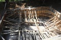 The ground recessed pool in the process of construction. Masonry formwork reinforced with bamboo trunks. Excavated clay piled up