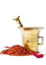 Ground red pepper and a vintage mortar Royalty Free Stock Photo