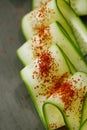 Ground Red Sumac Berries sprinkled on cucumber slice Royalty Free Stock Photo