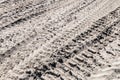 Ground and sand and tracks left by tank, tractor or other Royalty Free Stock Photo