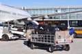 ground staff handling an aircraft before departure at the airport - loading luggage