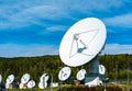 Ground station antenna aray with white dishes Royalty Free Stock Photo