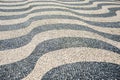 Ground street decoration traditional Lisbon cobblestone wave pattern Royalty Free Stock Photo