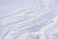 Ground surface covered with fluffy freshly fallen white snow.