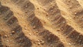 Ground surface features wave pattern, texture of tiny rock pieces and sandy soil. Arid, desert land background. Soil science Royalty Free Stock Photo