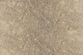 Ground texture - fragment of brown compact and stony ground - stony background