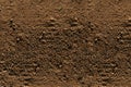 Ground texture - fragment of brown compact and stony ground - stony background