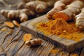 Ground turmeric on wooden board with roots