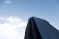 Ground view of a black tall glass building