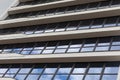 Ground view of glass square windows on white building facade with sky reflection, cutting-edge architecture design Royalty Free Stock Photo