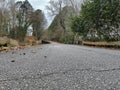 Ground view an old gravel country road with a Concrete bridge Royalty Free Stock Photo