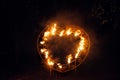 Ground wedding fireworks. Fire show, heart on dark background