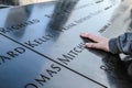 New York, Ground Zero, hand on the name of a victim of September 11