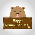 Groundhog Holding a Wooden Sign Royalty Free Stock Photo