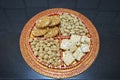 Groundnuts, ground nuts gachak sesame seeds rewari and gachak in a decorative plate lohari festival winter India. Snack.