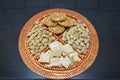 Groundnuts, ground nuts gachak sesame seeds rewari and gachak in a decorative plate lohari festival winter India. Snack.