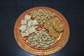 Groundnuts, ground nuts gachak sesame seeds rewari and gachak in a decorative plate lohari festival winter India. Snack