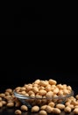 groundnuts put in glass plate on dark background Royalty Free Stock Photo