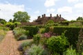 Grounds of Barrington Court near Ilminster Somerset England uk with gardens in summer sunshine