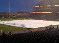 Grounds crew uses tarp to cover infield to save it