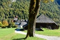 On the grounds of the Hirschau peninsula in Berchtesgaden with green meadows and mountains in the background