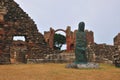 Within grounds of a ruined Priory.