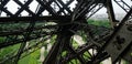 Eiffel Tower view through iron beams