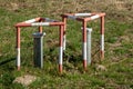 Groundwater measuring points with steel protection tube, end cap with hex locking and red and white concreted protection triangle