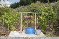 Groundwater wells in the countryside with chains and bucket, Water well in the nature