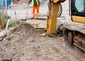 Groundworker is installing internal drainage for a house Royalty Free Stock Photo
